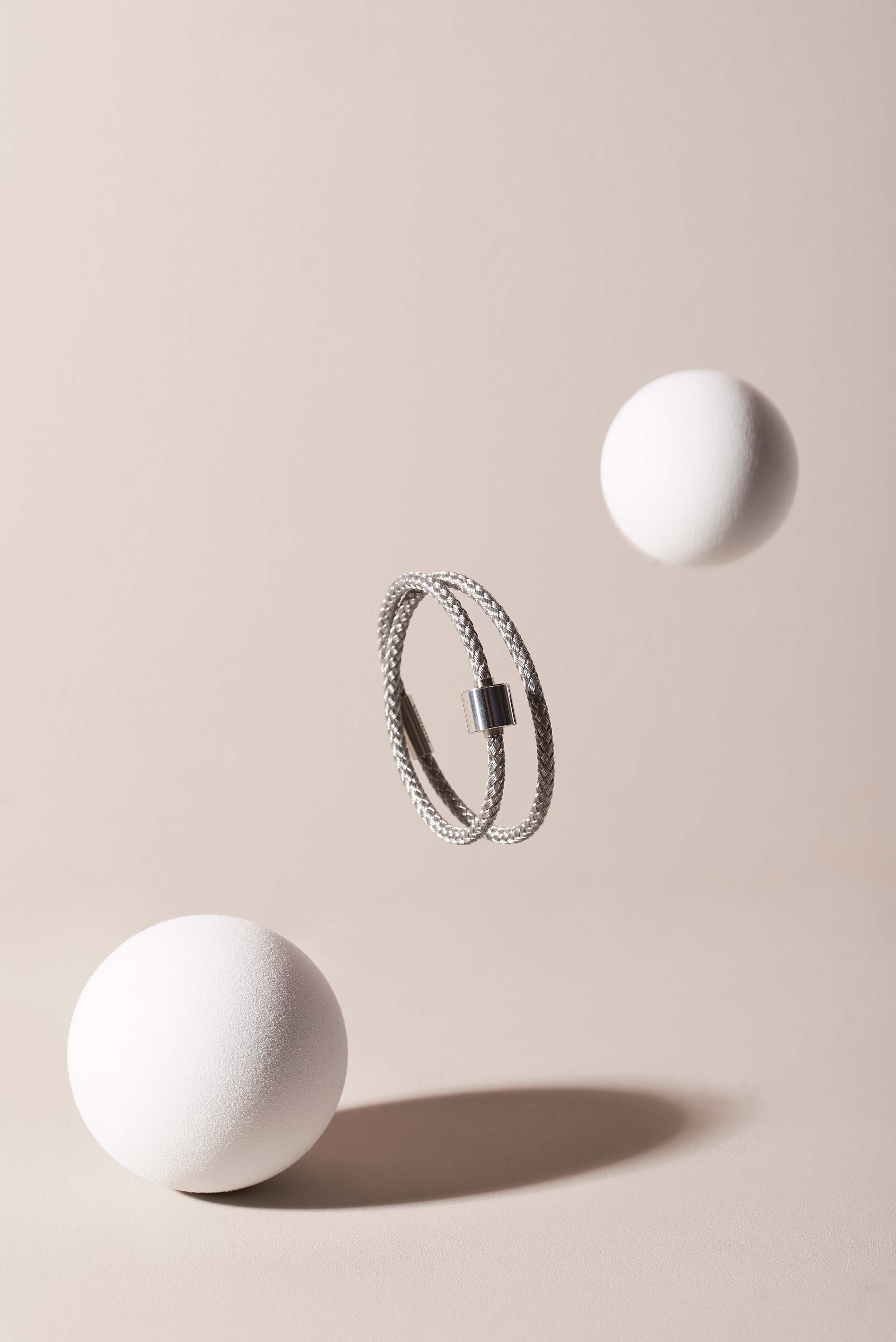 Product photography for Tadblu - floating memorial bracelet with beads and artistic presentation